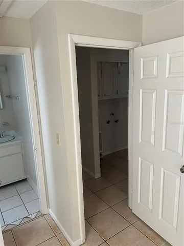 a view of a bathroom with a sink and a mirror