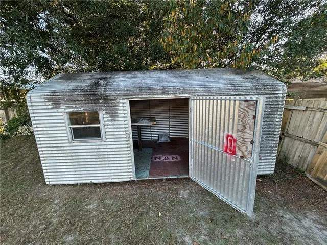 a view of a small space in front of a house