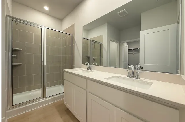 a bathroom with a shower and a toilet