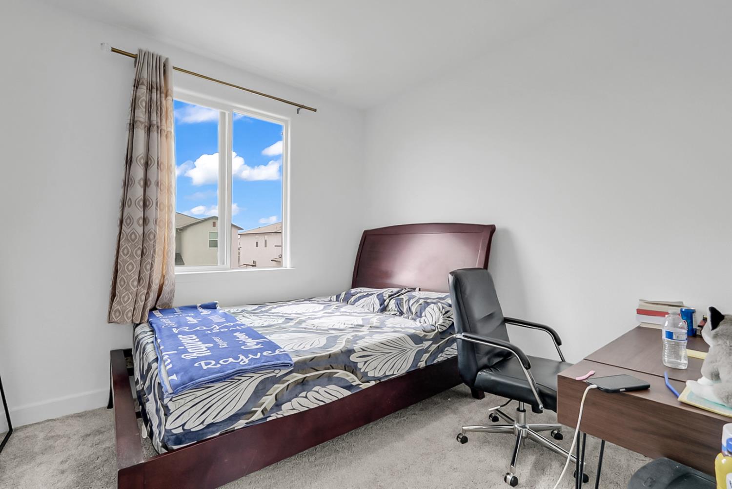 6705 Fathom Road Stockton, CA 95219 - Photo 11 of 19 a bedroom with a bed and a chair