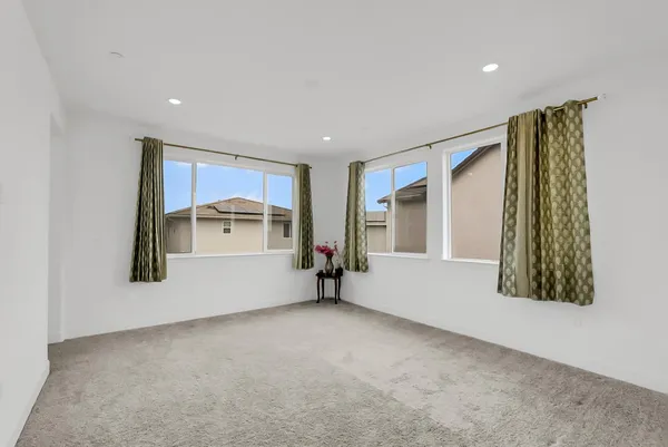 a bathroom with a tub sink shower and mirror