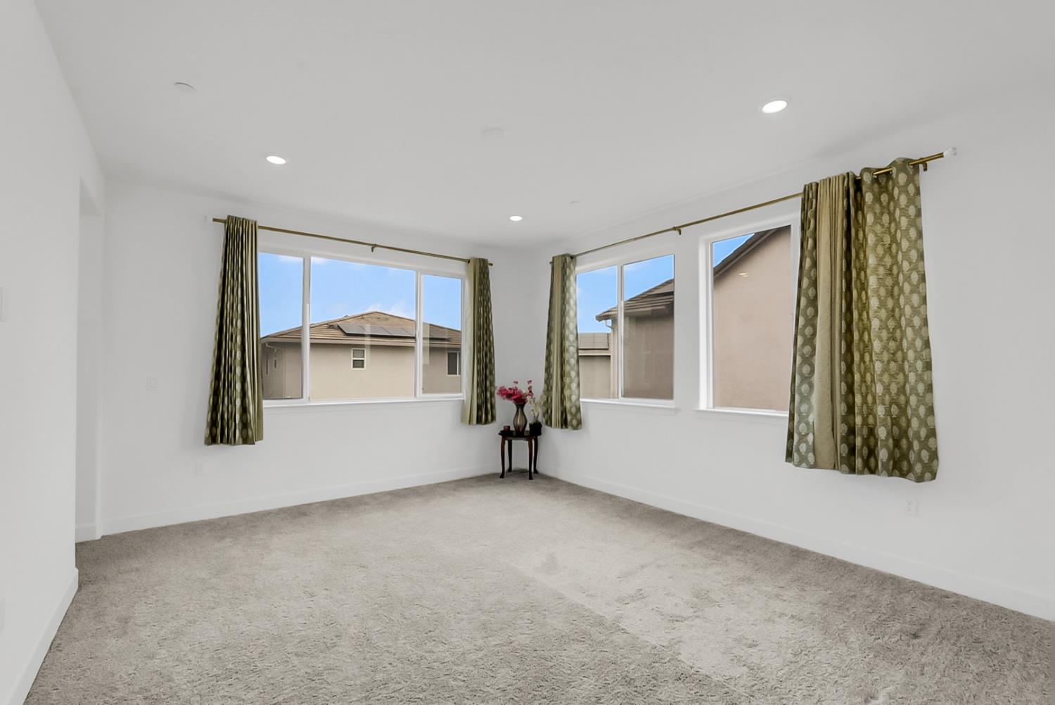 6705 Fathom Road Stockton, CA 95219 - Photo 12 of 19 a view of an empty room with a window and a kitchen