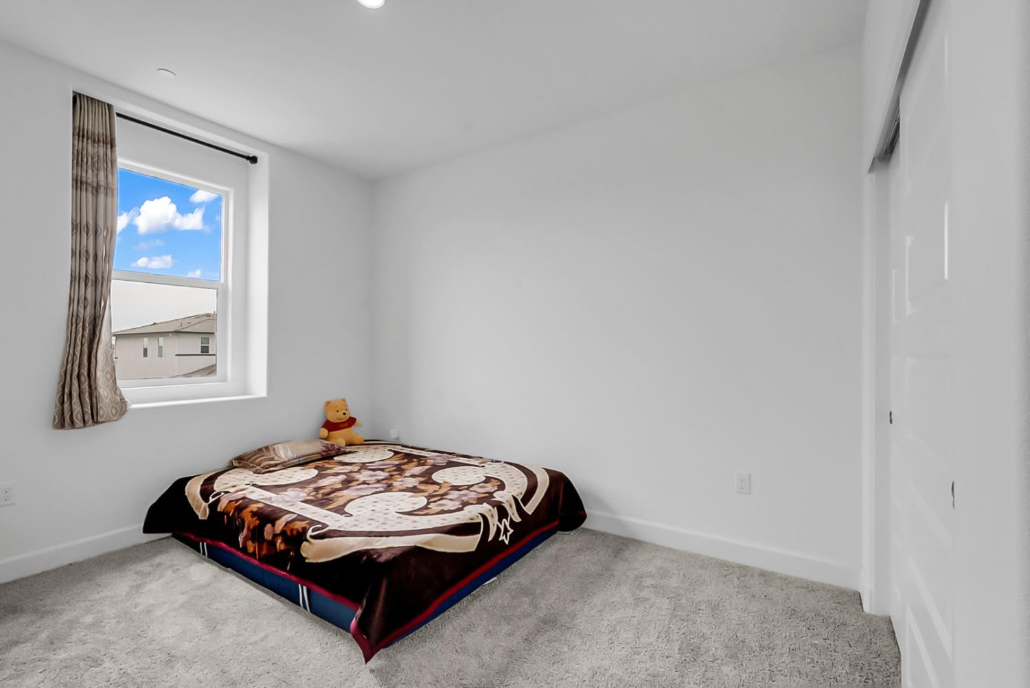 6705 Fathom Road Stockton, CA 95219 - Photo 15 of 19 a bedroom with a bed and window