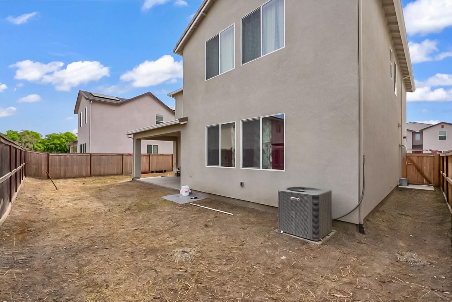 6705 Fathom Road Stockton, CA 95219 - Photo 17 of 19 a view of an house with backyard and a tree