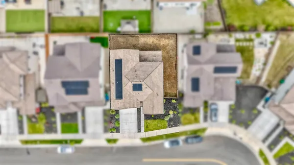 a view of a brick building next to a yard