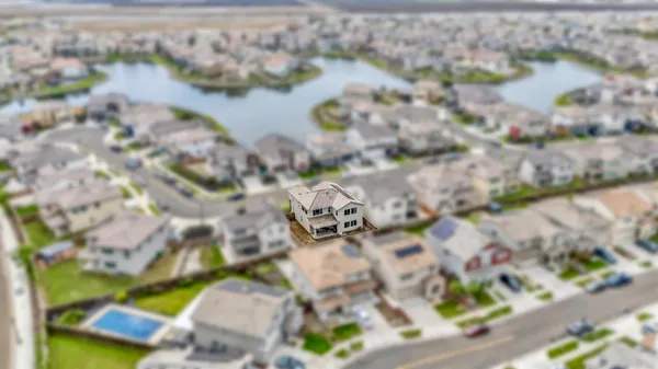 a kitchen with stainless steel appliances a stove a sink a microwave and cabinets