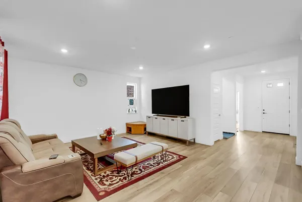 a bedroom with a bed and a chair