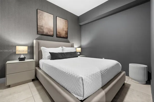 a bedroom with bed and window