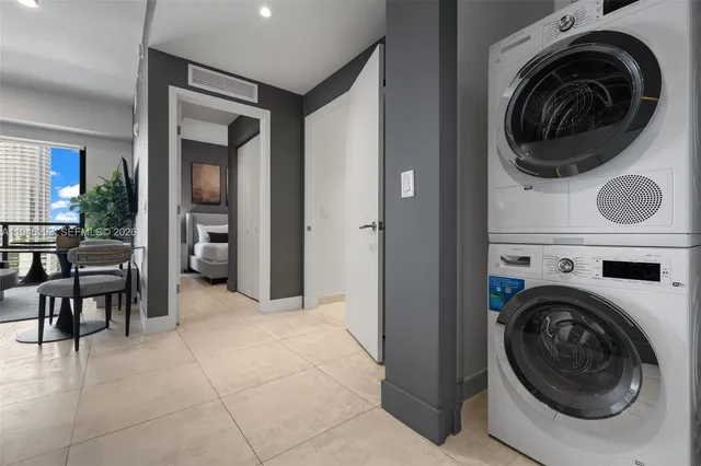 a view of a hallway with washer and dryer