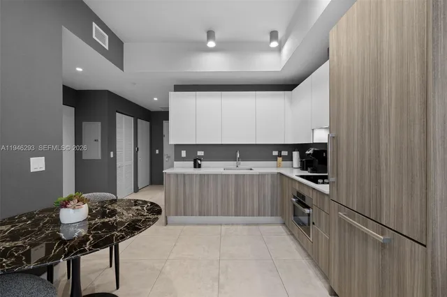 a kitchen with a cabinets and appliances