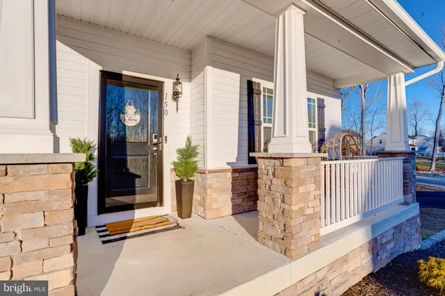 a bathroom with a sink a mirror and shower