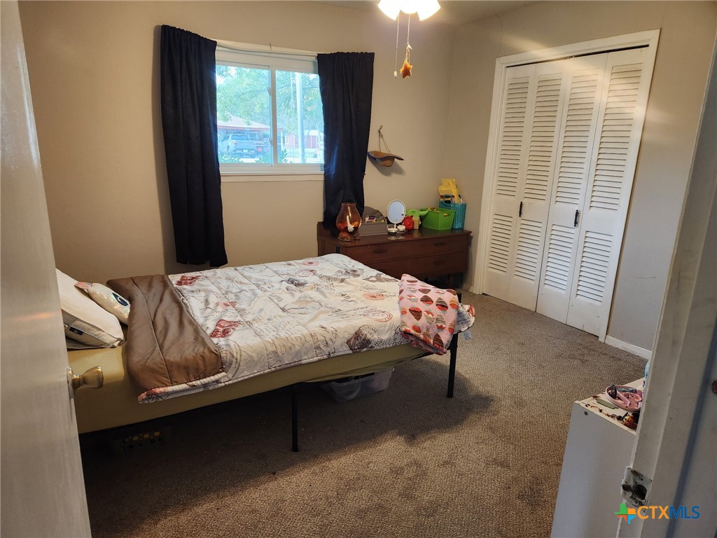 306 Dover Street Victoria, TX 77905 - Photo 16 of 23 a bedroom with a bed and a window