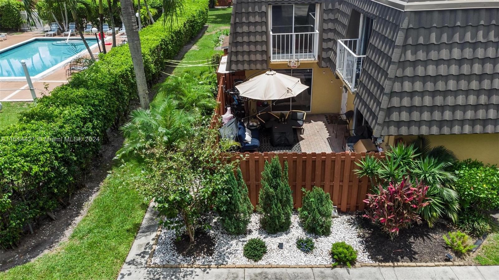 22169 Boca Rancho Drive, Unit B Boca Raton, FL 33428 - Photo 29 of 41 a view of a chair and table in backyard