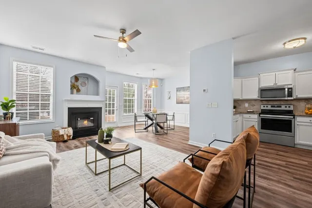 a living room with furniture and a fireplace