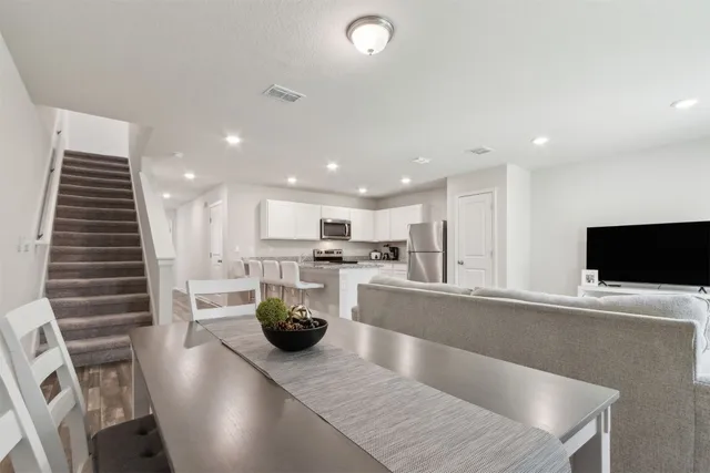 a kitchen with stainless steel appliances granite countertop a sink counter space and cabinets