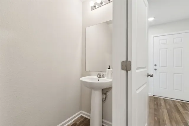 a bathroom with a sink a mirror and shower