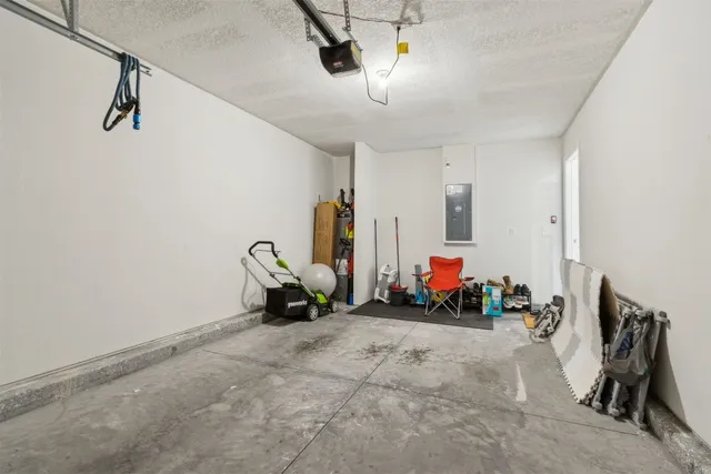 a view of a bathroom with a tub and door