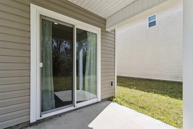 a view of a house with backyard and porch
