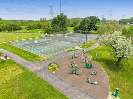 a view of yard from deck with patio