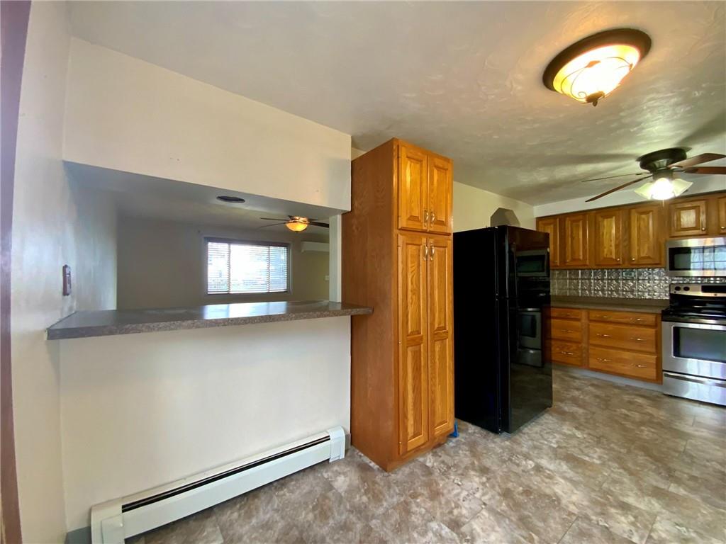 292 Tomlinson Run Georgetown, PA 15043 - Photo 12 of 32 Eat in kitchen with bar/counter space. New laminate flooring