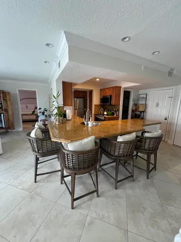a living room with furniture a dining table and chairs