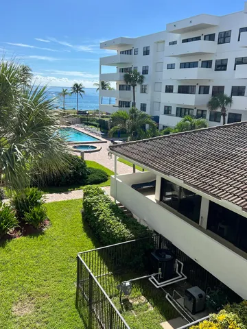 a view of a swimming pool with a garden