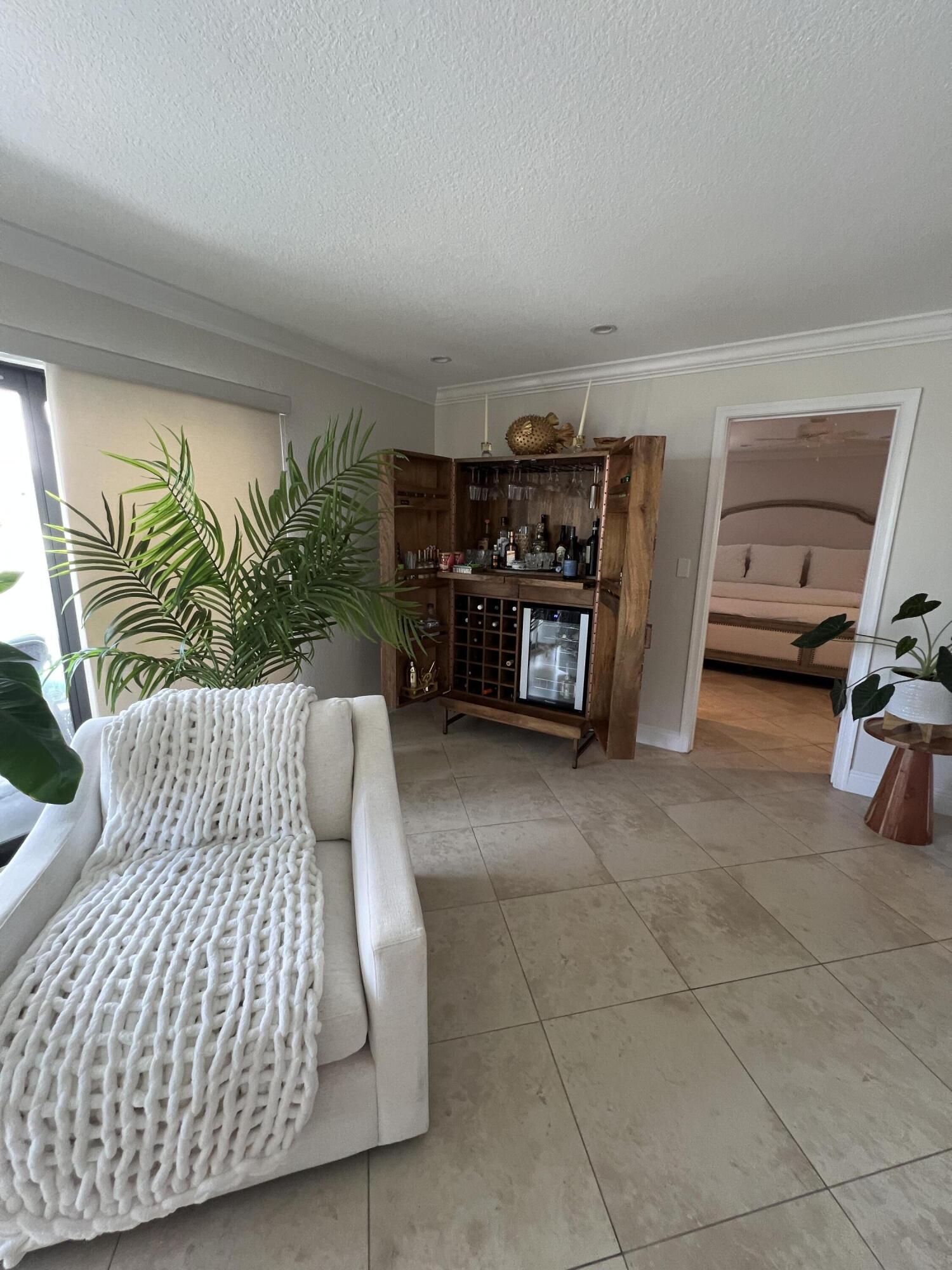 330 Southeast 20th Avenue, Unit 315 Deerfield Beach, FL 33441 - Photo 22 of 33 a bedroom with a bed and a couch