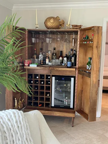 a kitchen with a wooden floor and a shelf
