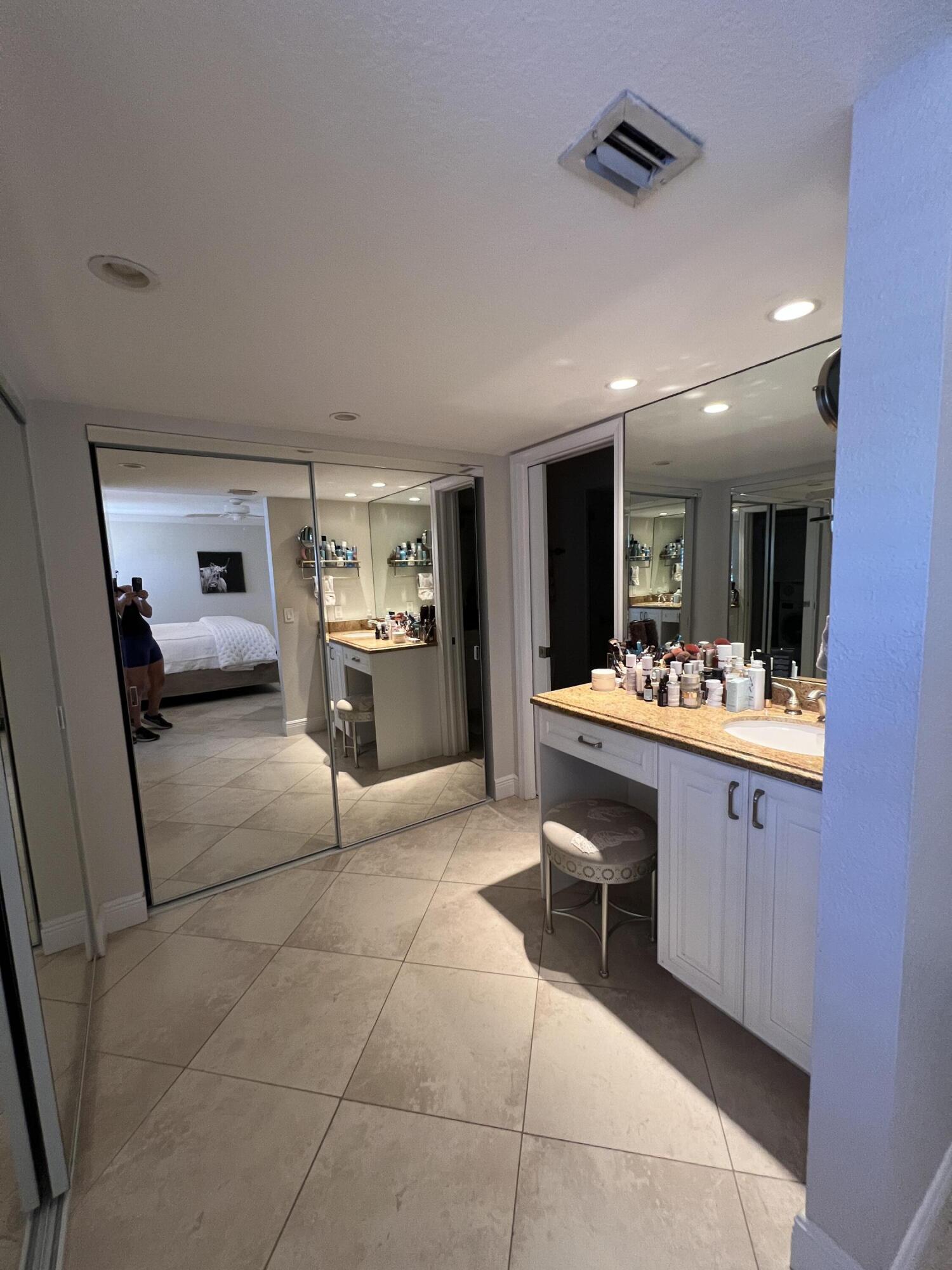 330 Southeast 20th Avenue, Unit 315 Deerfield Beach, FL 33441 - Photo 27 of 33 a view of living room kitchen with stainless steel appliances kitchen island granite countertop furniture and a view of living room