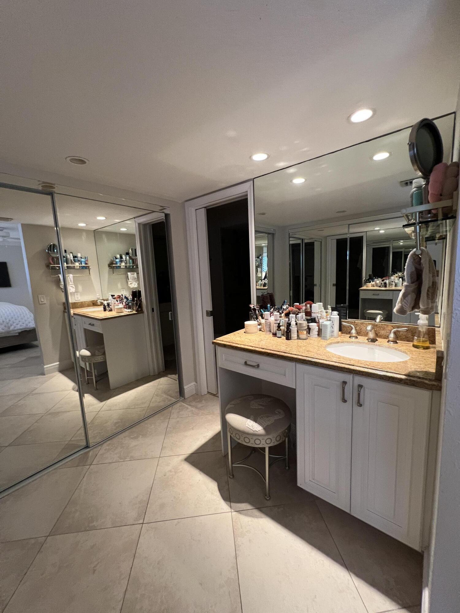 330 Southeast 20th Avenue, Unit 315 Deerfield Beach, FL 33441 - Photo 28 of 33 a bathroom with a sink and mirror