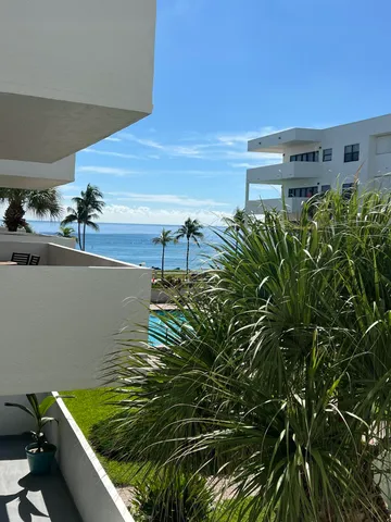 a view of swimming pool from a balcony