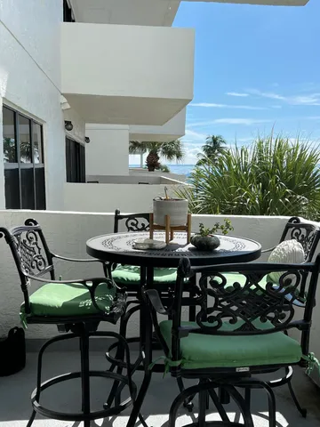 a view of a table and chairs in the patio