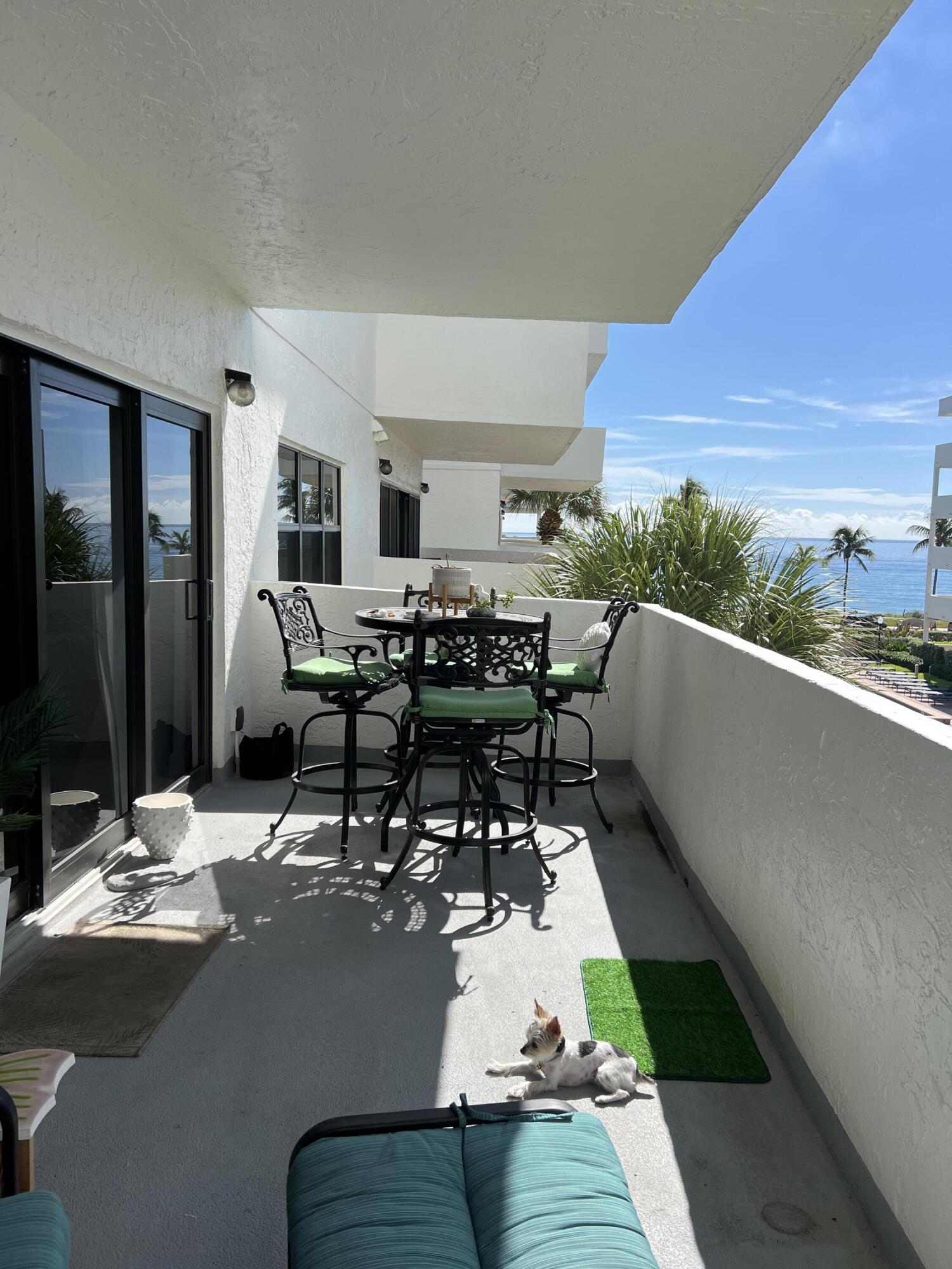 330 Southeast 20th Avenue, Unit 315 Deerfield Beach, FL 33441 - Photo 7 of 33 a living room with dining room and couches chair