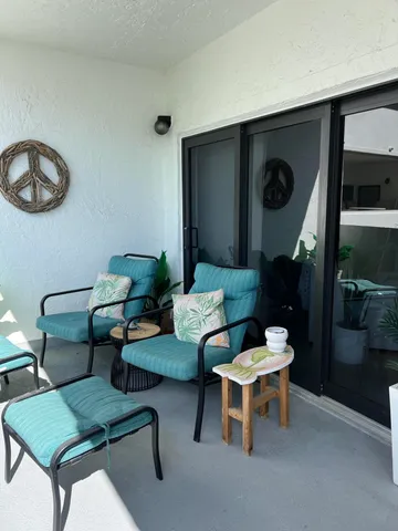a living room with furniture and a lamp