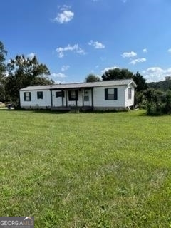 7486 Duncan Bridge Road Cleveland, GA 30528 - Photo 1 of 1 a front view of a house with yard