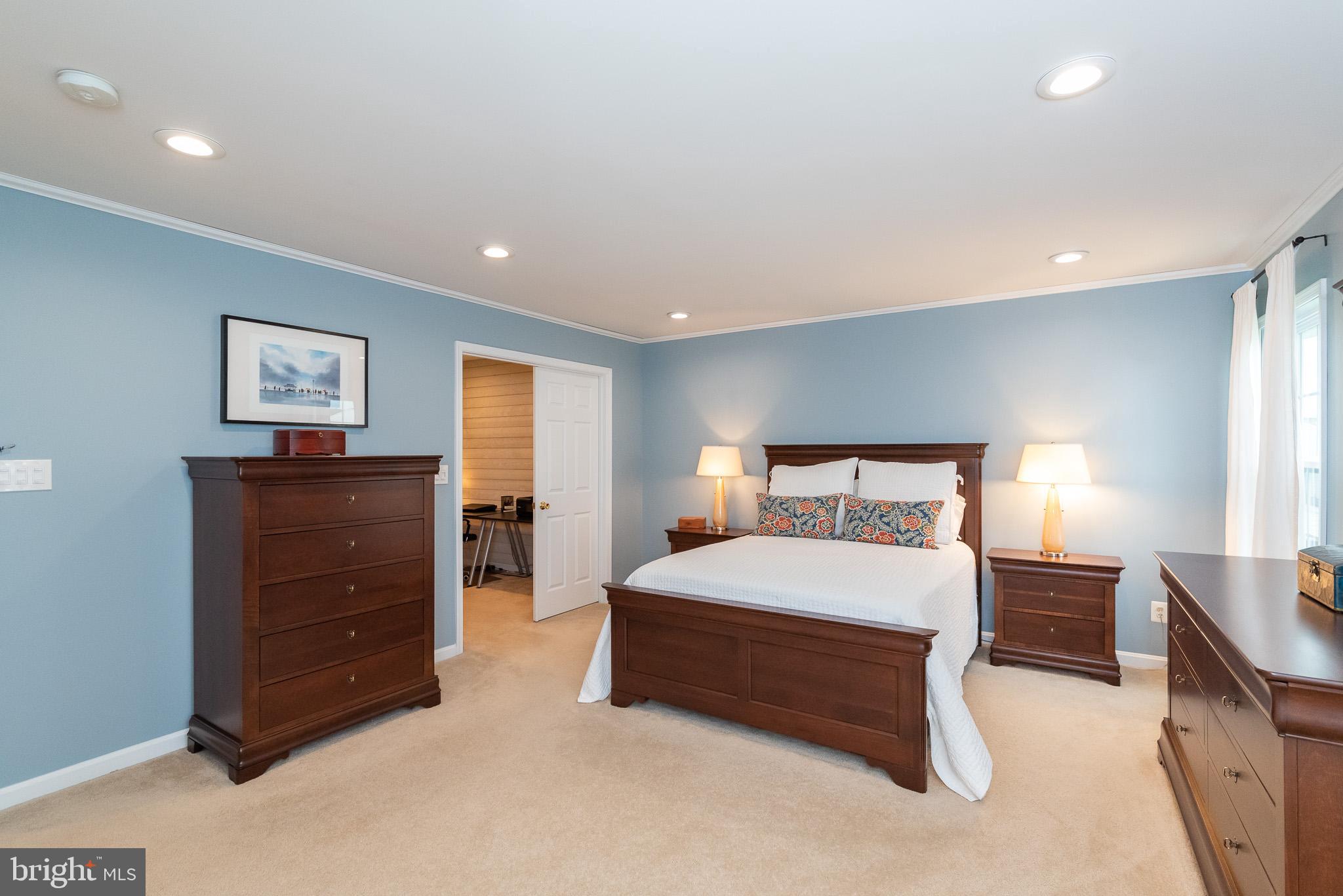 709 Walnut Grove Road Baltimore, MD 21221 - Photo 34 of 52 a bedroom with a bed and a dresser