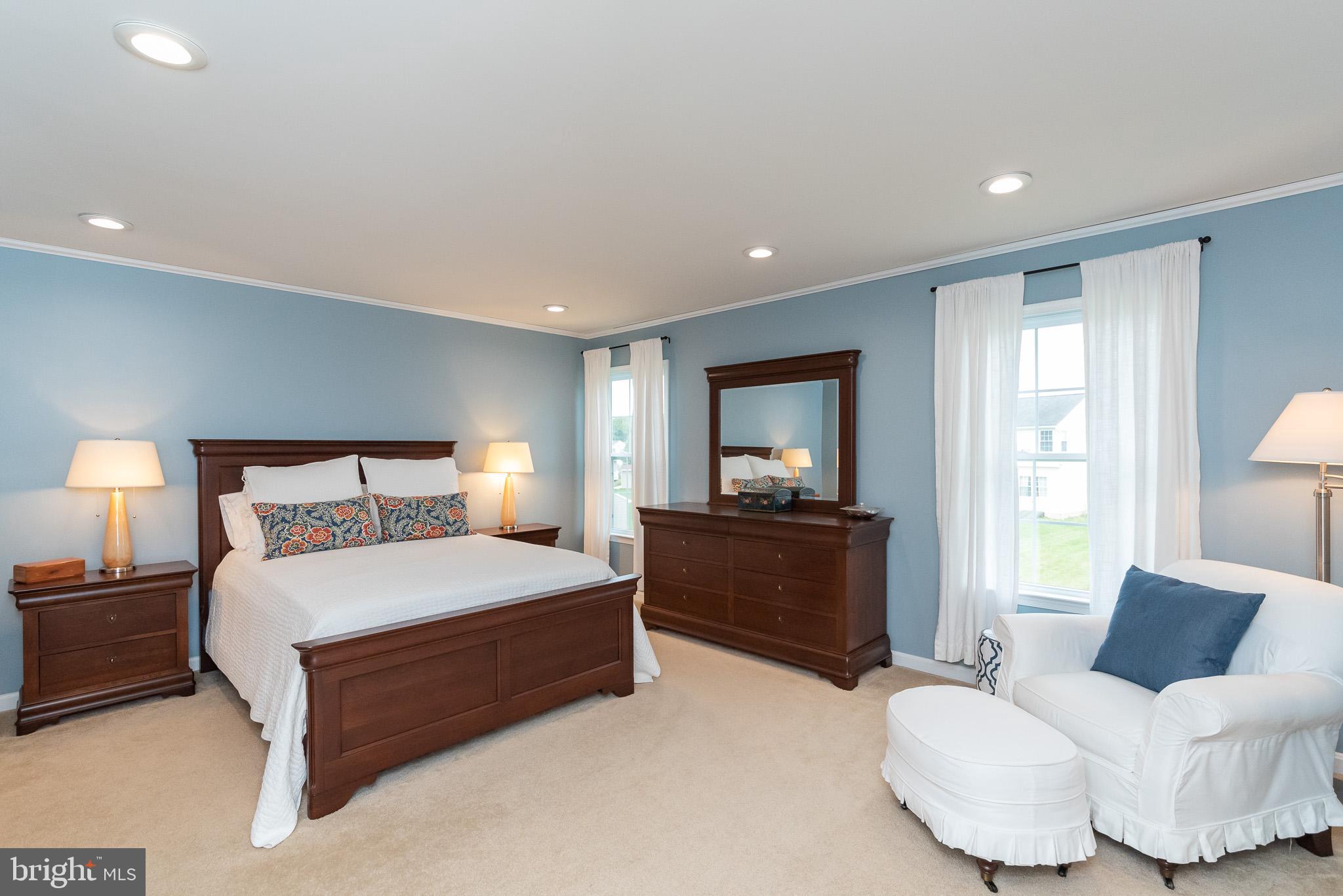709 Walnut Grove Road Baltimore, MD 21221 - Photo 35 of 52 a bedroom with a large bed and a couch