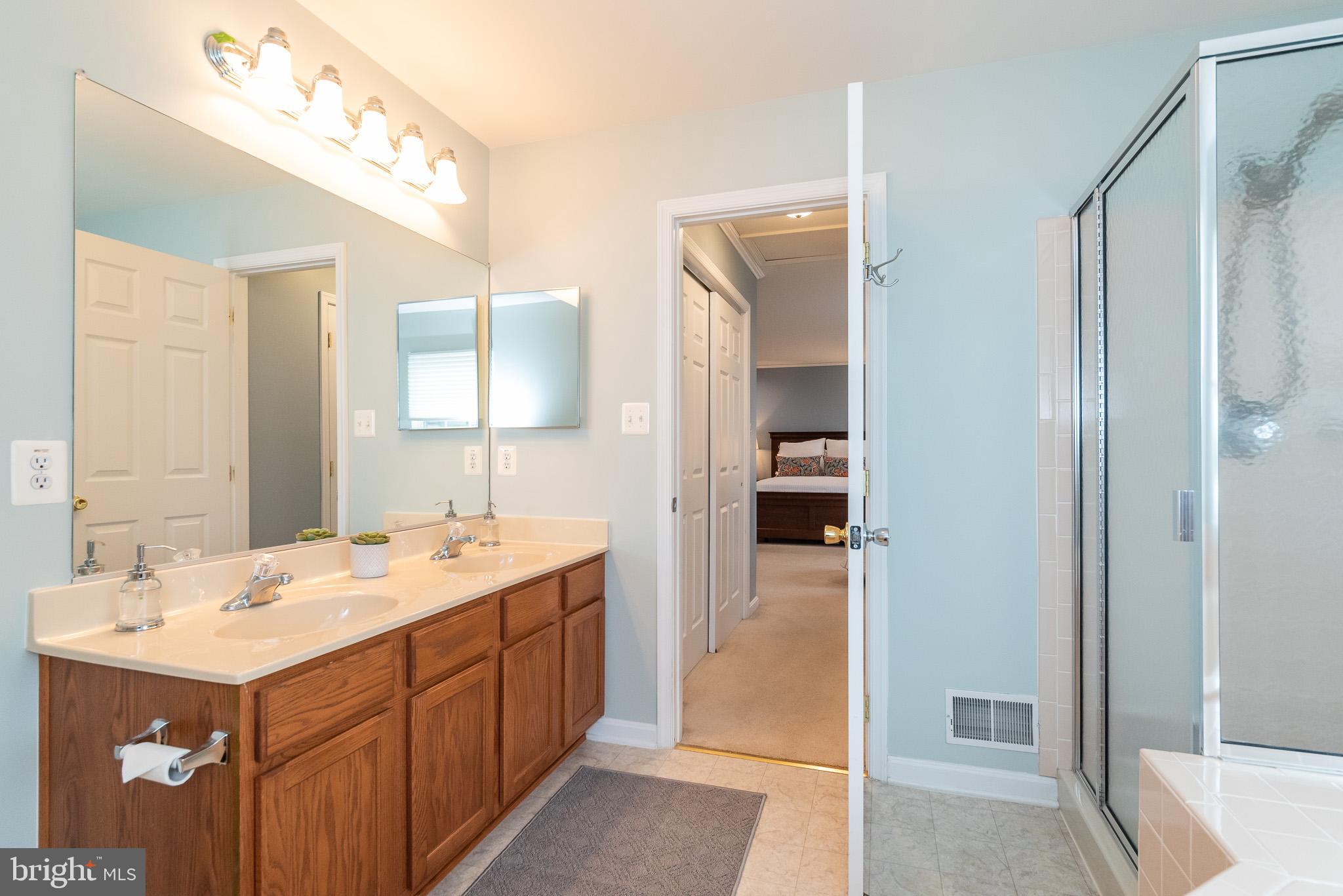 709 Walnut Grove Road Baltimore, MD 21221 - Photo 40 of 52 a bathroom with a sink vanity and mirror
