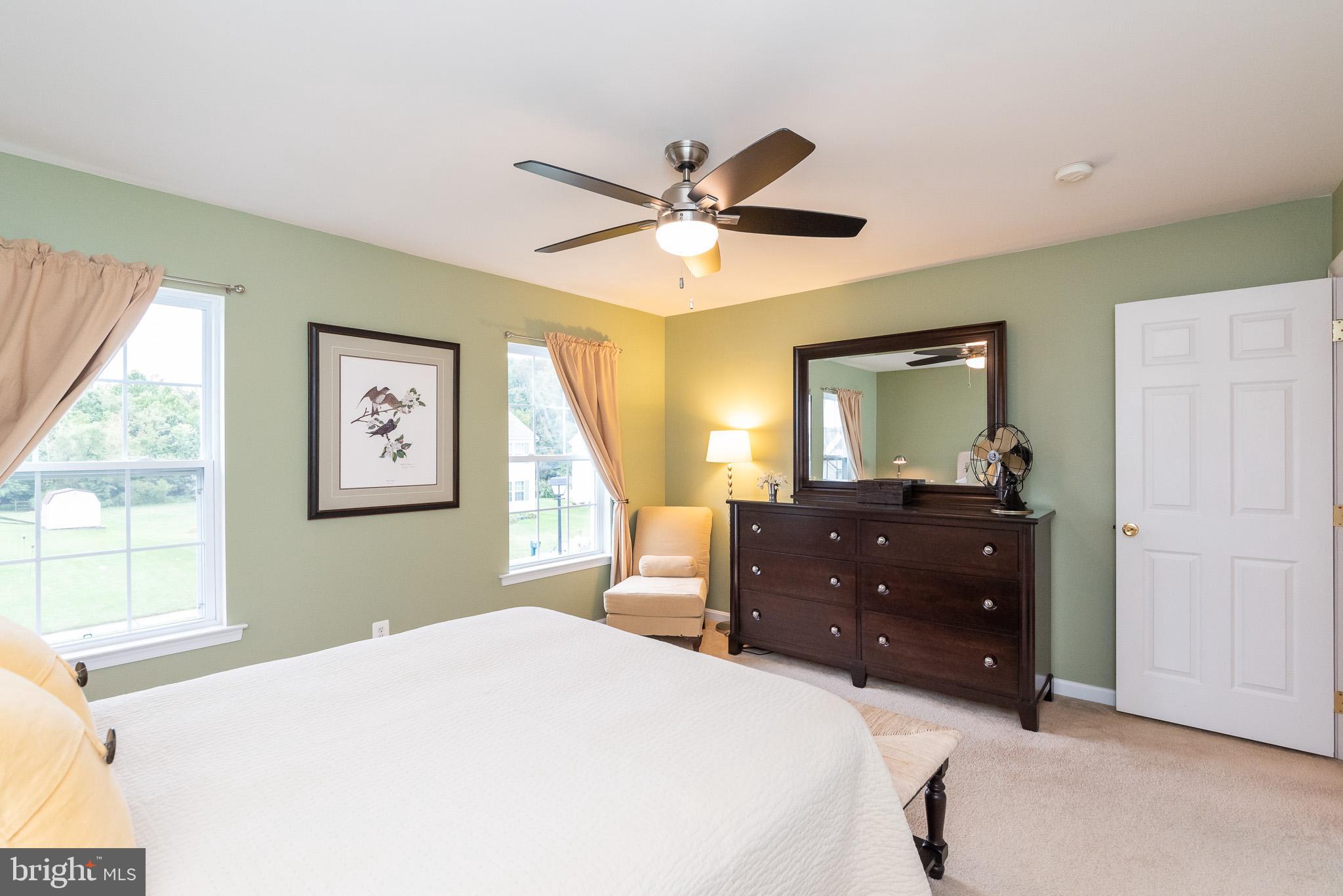 709 Walnut Grove Road Baltimore, MD 21221 - Photo 43 of 52 a bedroom with a bed and a dresser
