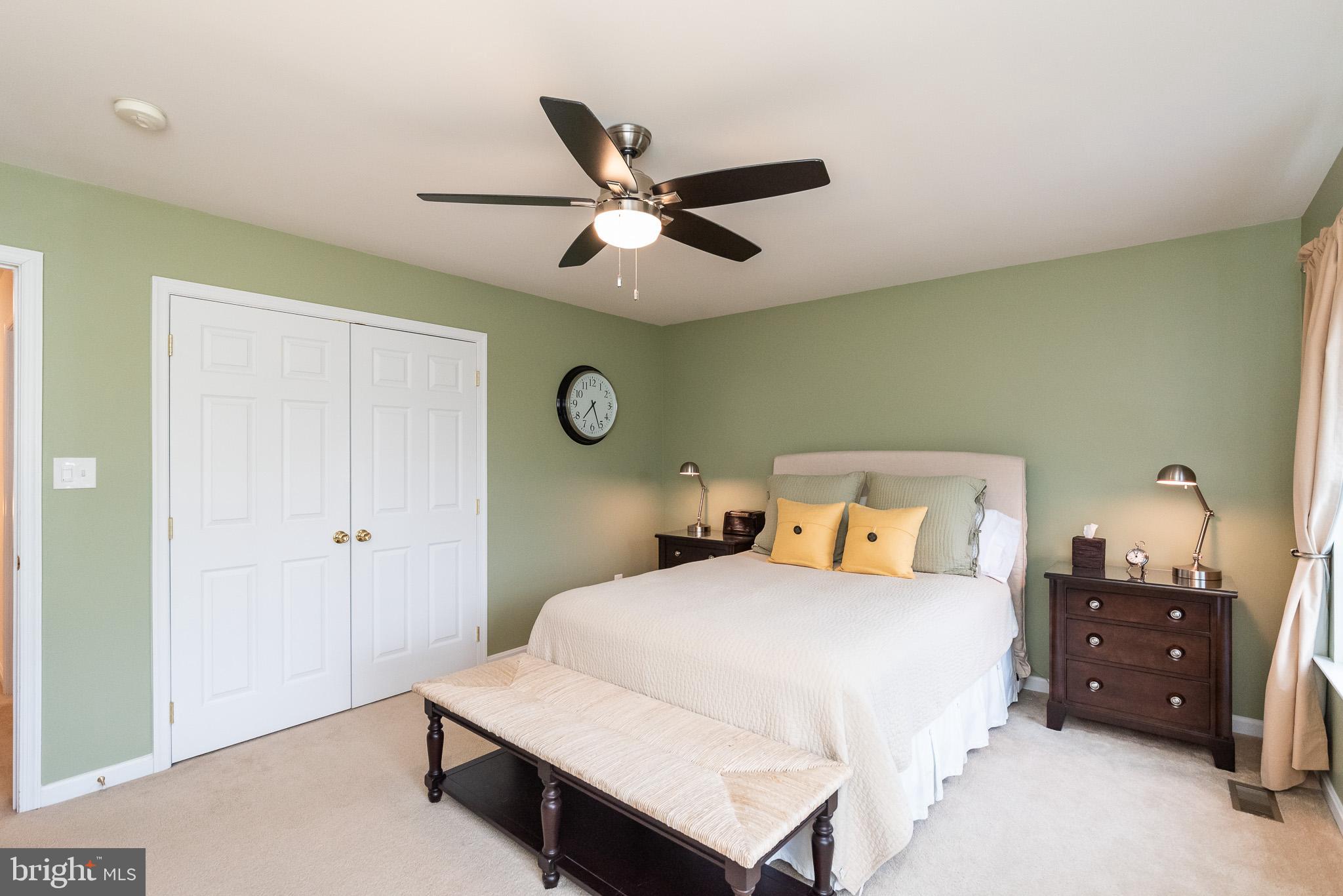 709 Walnut Grove Road Baltimore, MD 21221 - Photo 44 of 52 a bedroom with a bed and a chandelier
