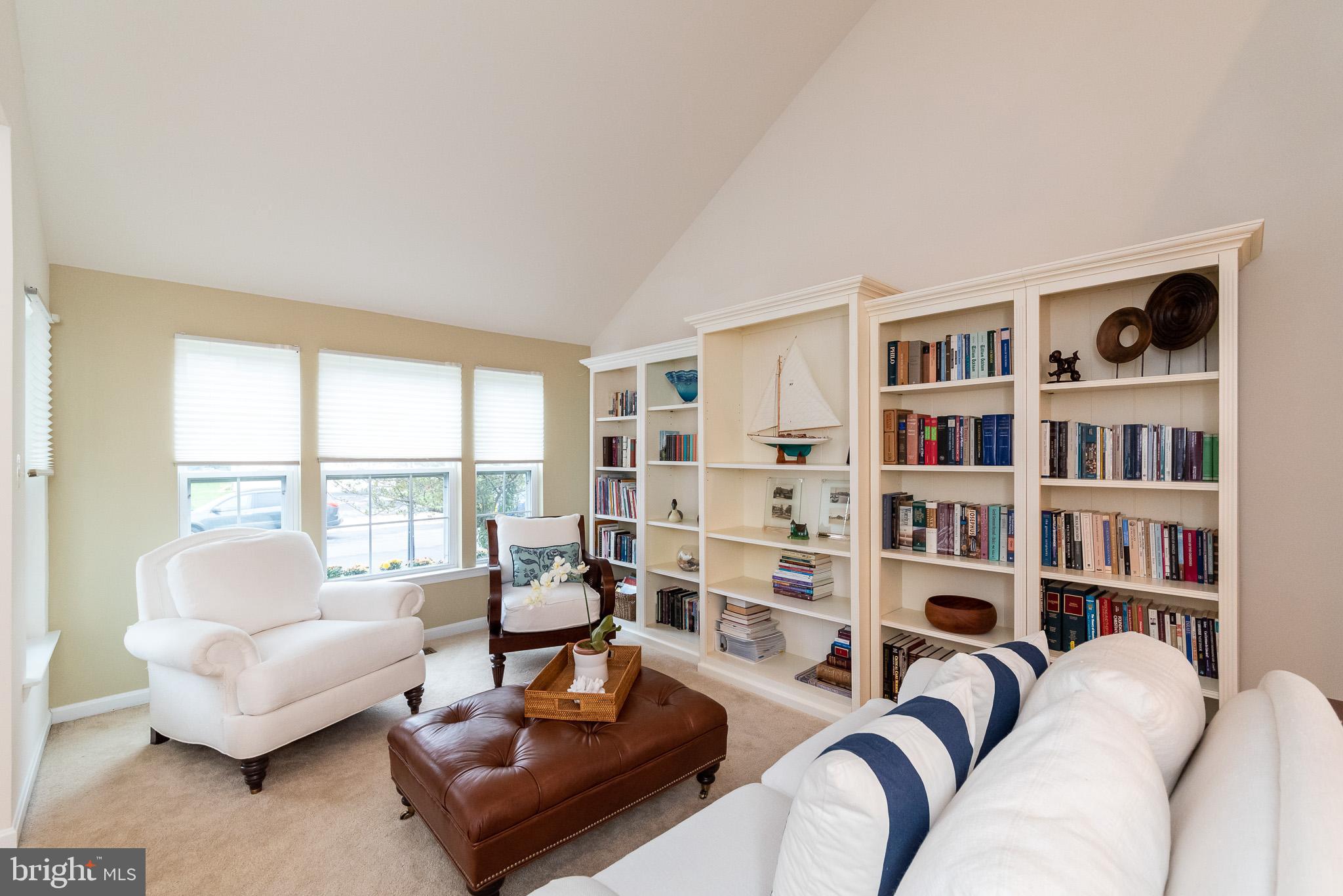 709 Walnut Grove Road Baltimore, MD 21221 - Photo 9 of 52 a living room with furniture and a book shelf