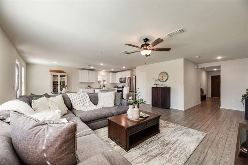 Newly added ceiling fan in family living room, spacious open concept layout