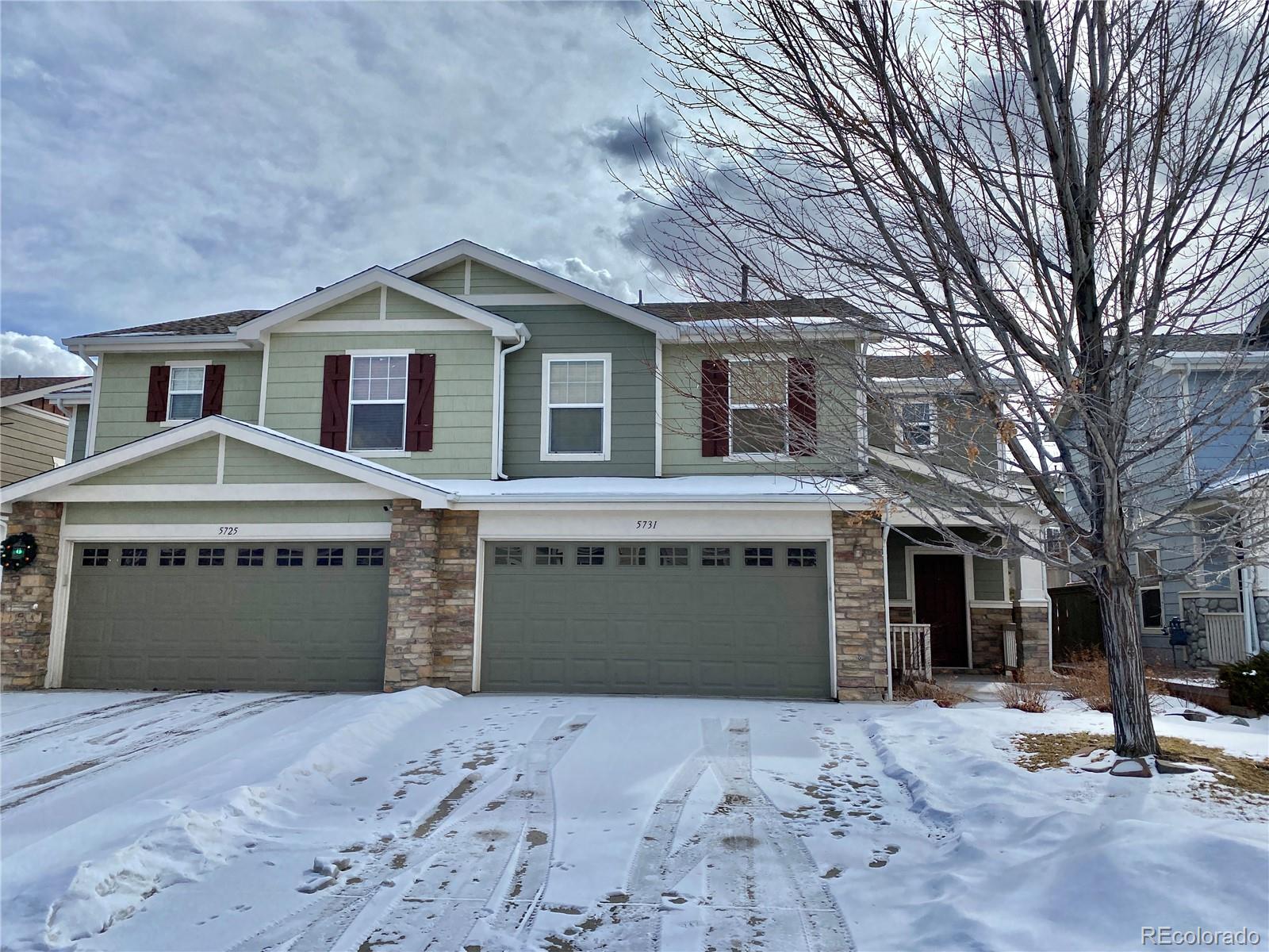 5731 Raleigh Circle Castle Rock, CO 80104 - Photo 1 of 16 a front view of a house with a yard and garage
