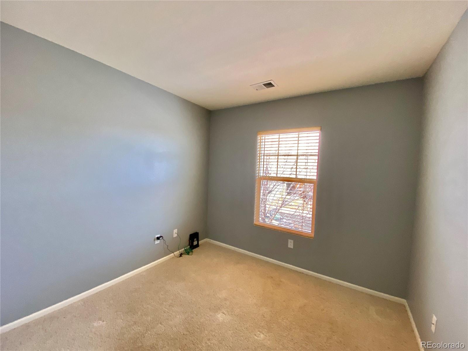 5731 Raleigh Circle Castle Rock, CO 80104 - Photo 12 of 16 an empty room with windows