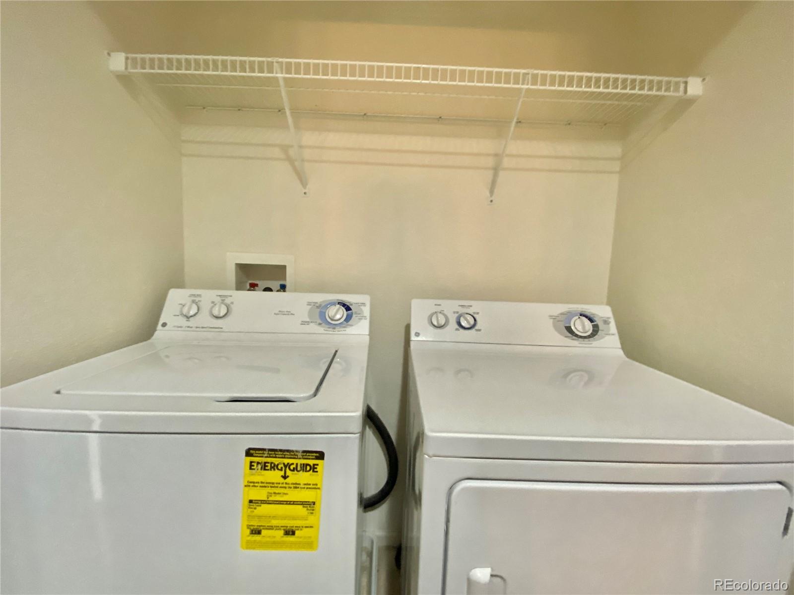 5731 Raleigh Circle Castle Rock, CO 80104 - Photo 15 of 16 a utility room with dryer and washer