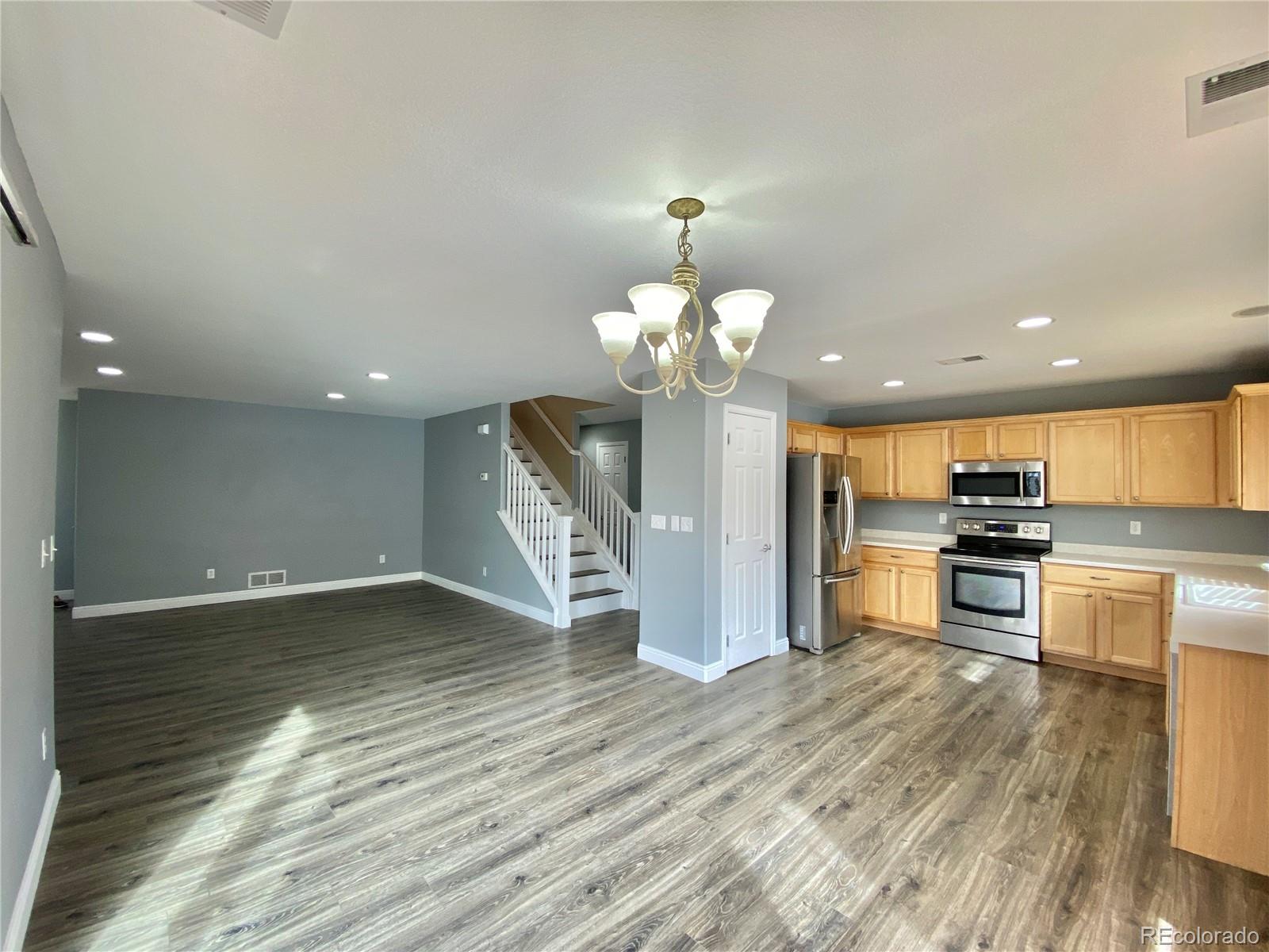 5731 Raleigh Circle Castle Rock, CO 80104 - Photo 3 of 16 a view of a kitchen with a sink and microwave