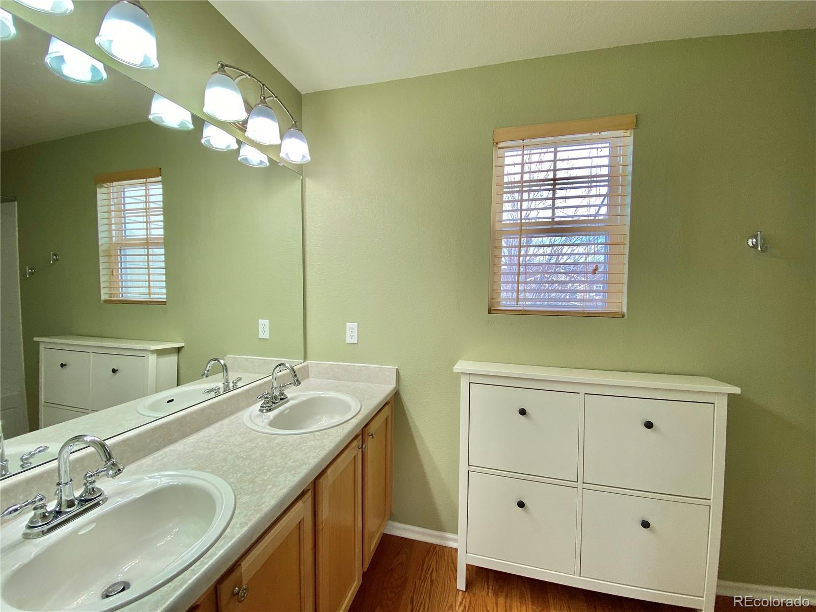5731 Raleigh Circle Castle Rock, CO 80104 - Photo 10 of 16 a bathroom with a sink a vanity and a mirror