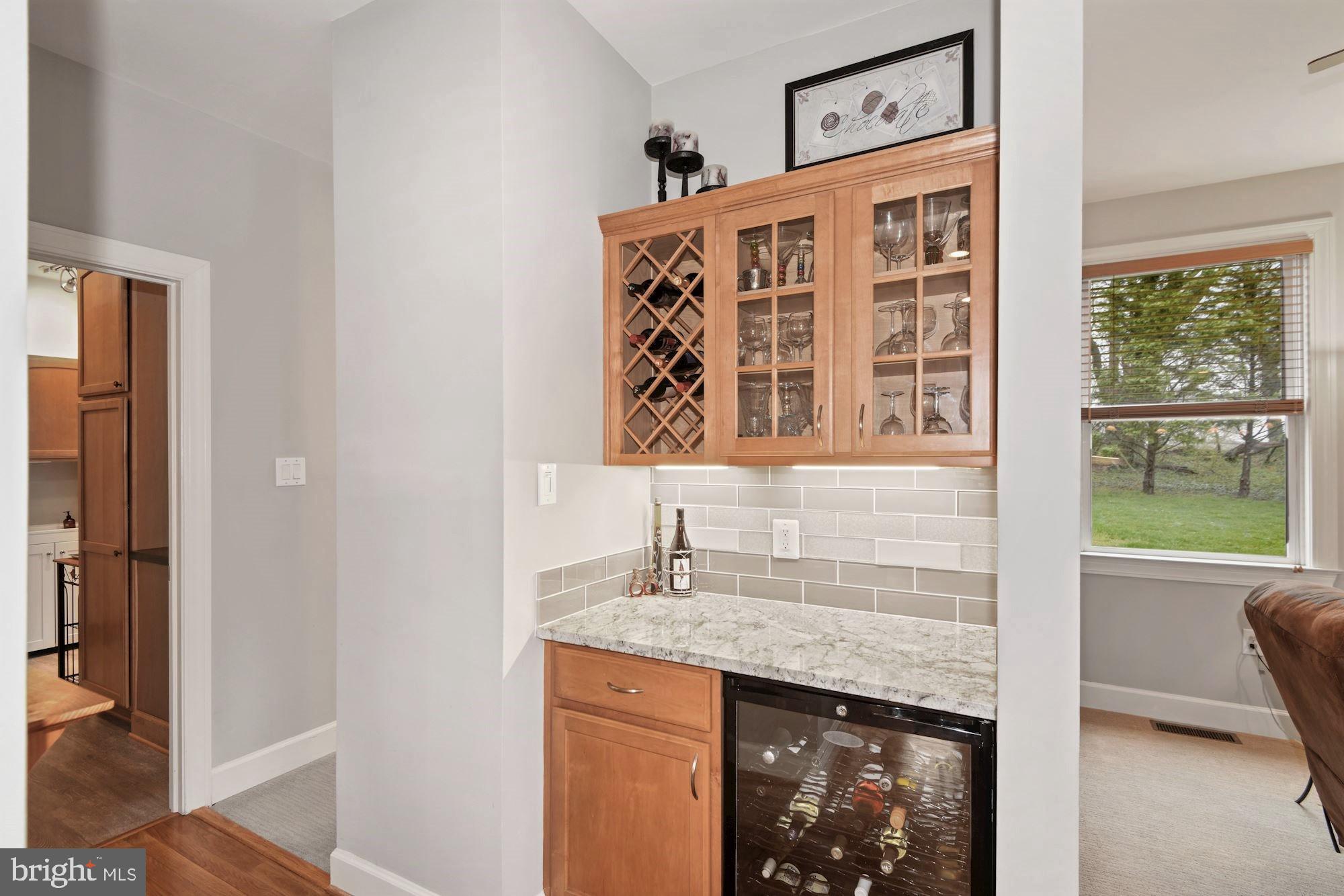 825 Mt Airy Road Davidsonville, MD 21035 - Photo 13 of 42 Dry bar with wine cooler and storage