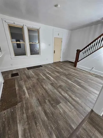 a view of a livingroom with wooden floor