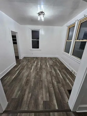 a view of an empty room with a fireplace